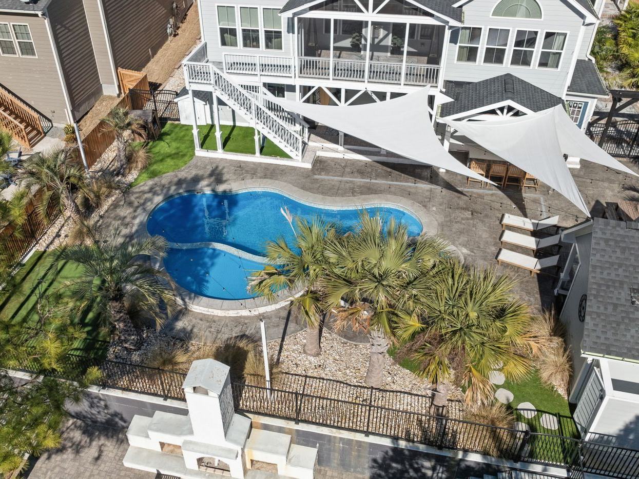 Aerial view of a freeform, kidney-shaped pool
